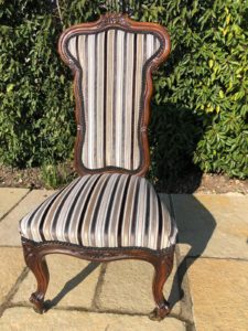 An old Victorian prayer chair recovered in a velvet stripe
