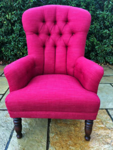 Before and after of a button back chair, recovered in a Laura Ashley fabric