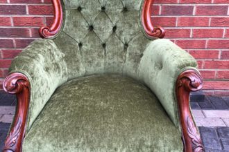 Old Victorian buttoned back chair reupholstered and recovered in green velvet