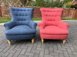 A pair of chairs recovered in pink and blue linwood fabric