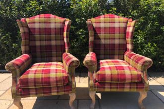 A pair of old wing back chairs recovered and reupholstered - Fordingbridge