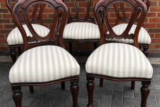 A set of antique reproduction dining chairs fully reupholstered and recovered