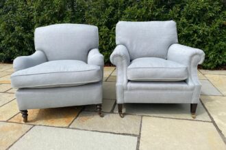A pair of George Smith chairs recovered with new feather cushions