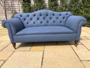 Edwardian buttoned settee completely reupholstered and recovered with new springs in blue herringbone wool