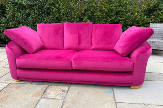 3 seated settee recovered and repaired in a magenta velvet from Sunbury Design