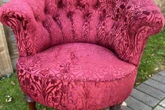 Antique buttoned back chair recovered in clients own fabric