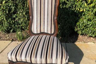 An old Victorian prayer chair recovered in a velvet stripe