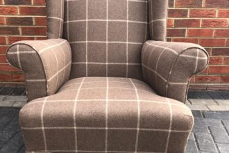 An old winged back chair recovered