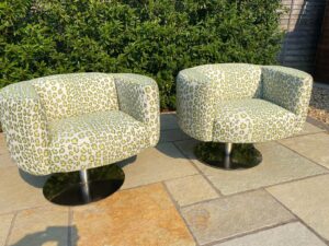 A pair of Carter chairs recovered in Leopardo Verde