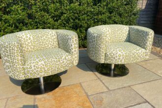 A pair of Carter chairs recovered in Leopardo Verde