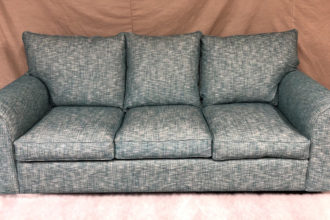 Collins and Hayes settee covered in client's own fabric