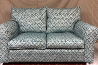 Collins and Hayes settee covered in client's own fabric