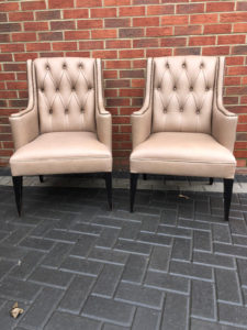 2 antique chairs recovered in leather with an individual stud finish.
