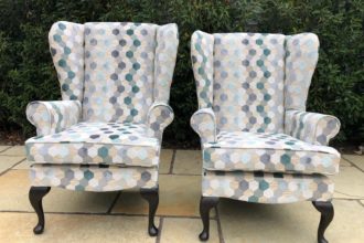 Before and after of two winged back arm chairs recovered and reupholstered in geometric design fabric