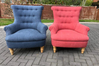 A pair of buttoned armchairs recovered in Linwood fabrics
