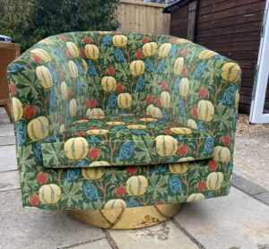 Large tub chair recovered in a vibrant Baker velvet print with a new brass base