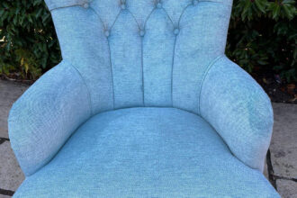 Bedroom chair recovered in blue velvet fabric
