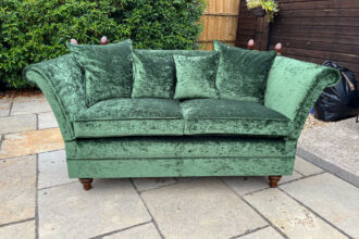 Laura Ashley knoll sofa recovered in green velvet